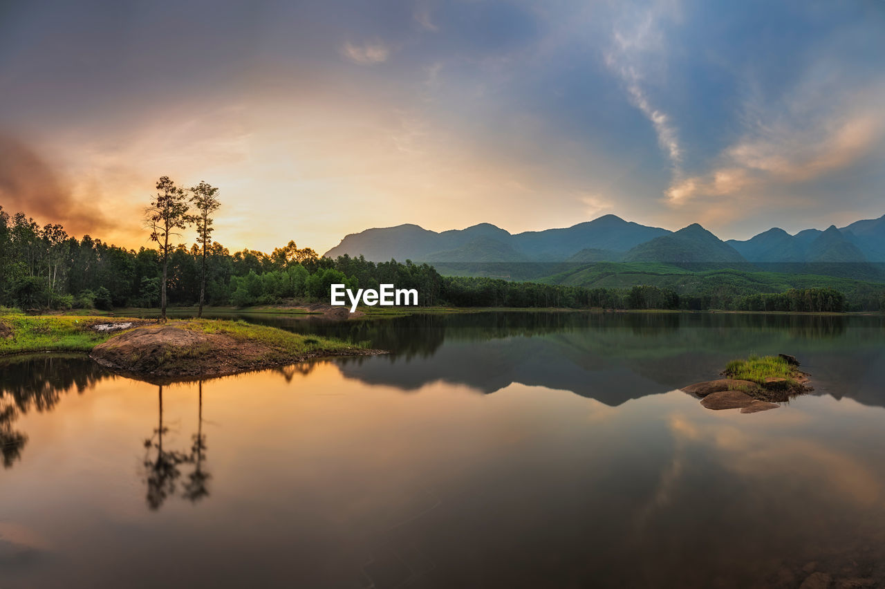 Scenic view of lake against sky during sunset