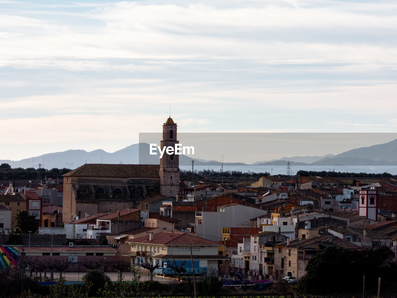 Buildings in the city of brafim  against cloudy sky