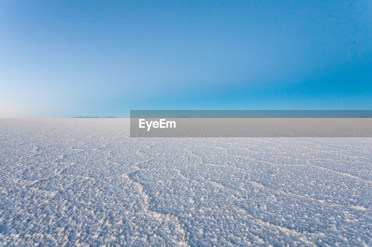 SCENIC VIEW OF SNOW AGAINST CLEAR BLUE SKY