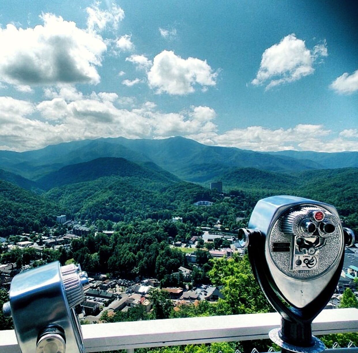 CLOSE-UP OF CITYSCAPE AGAINST MOUNTAIN