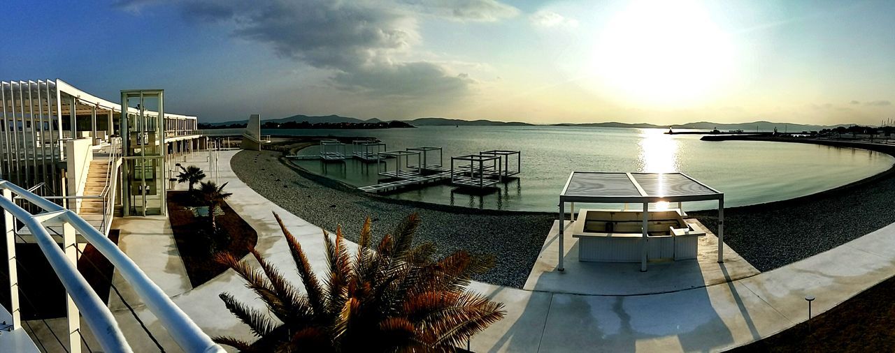 PANORAMIC VIEW OF SEA AND BUILDINGS AGAINST SKY