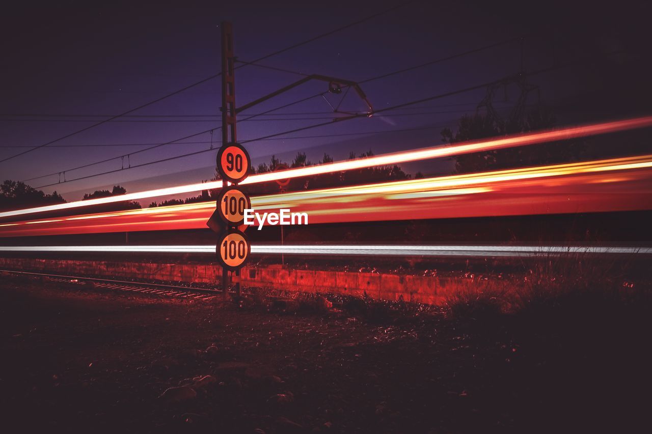 Light trails on railroad tracks at night