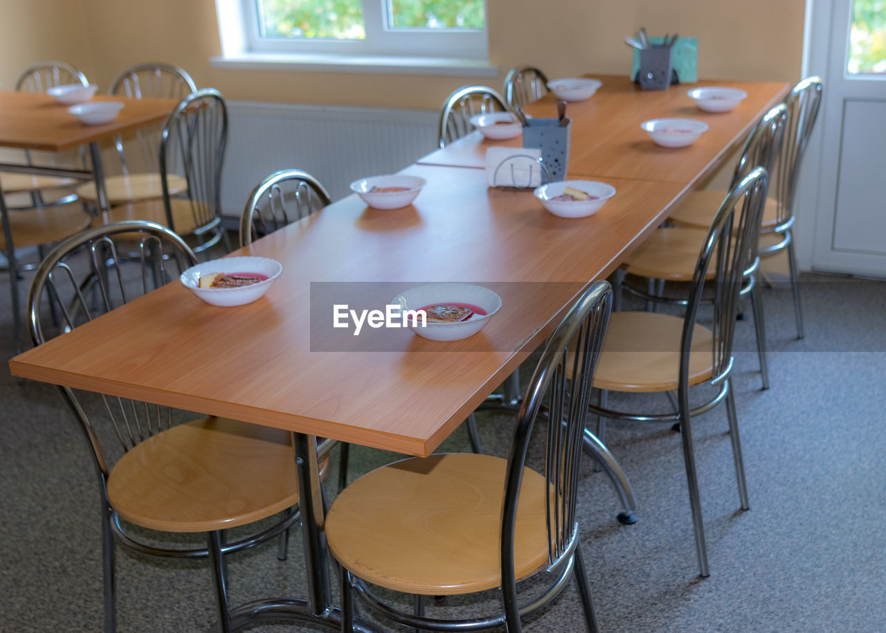 School kitchen canteen, set tables, canteen equipment, catering establishment, tables and chairs