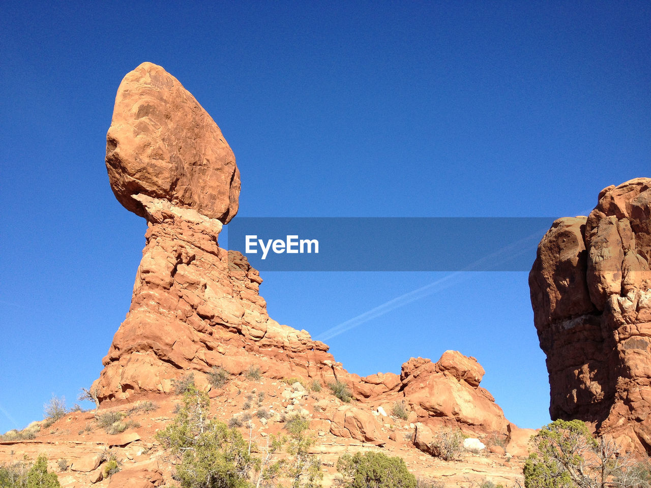 Scenic view of rocky mountains against blue sky