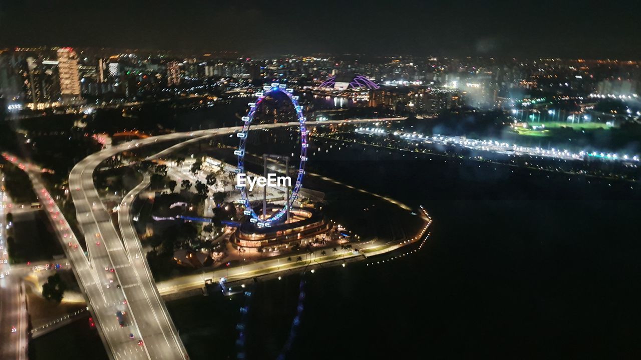HIGH ANGLE VIEW OF ILLUMINATED CITY