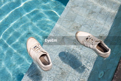 Adult sneakers swim in the pool. shoes | ID: 175638560