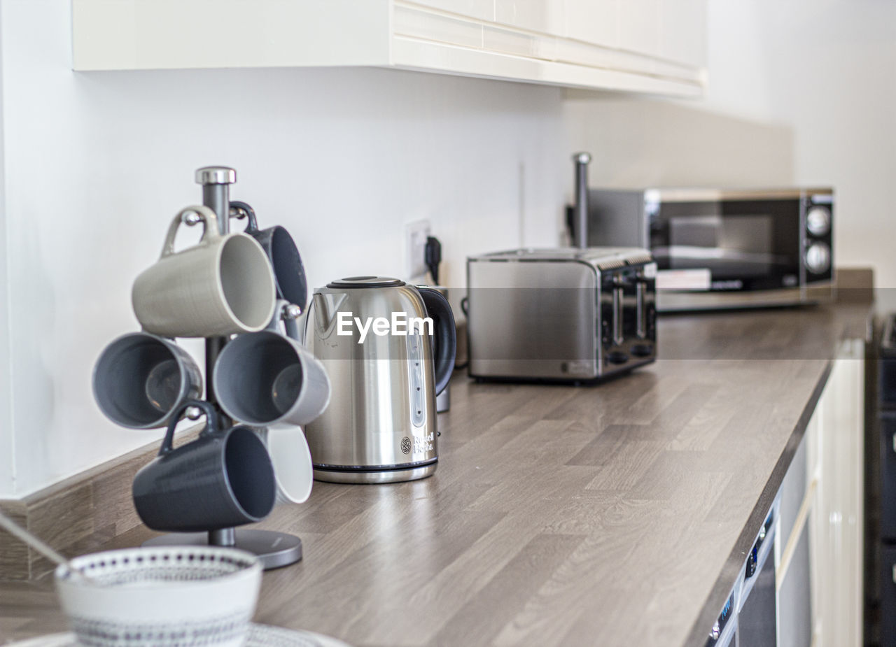 CLOSE-UP OF KITCHEN UTENSILS AT HOME