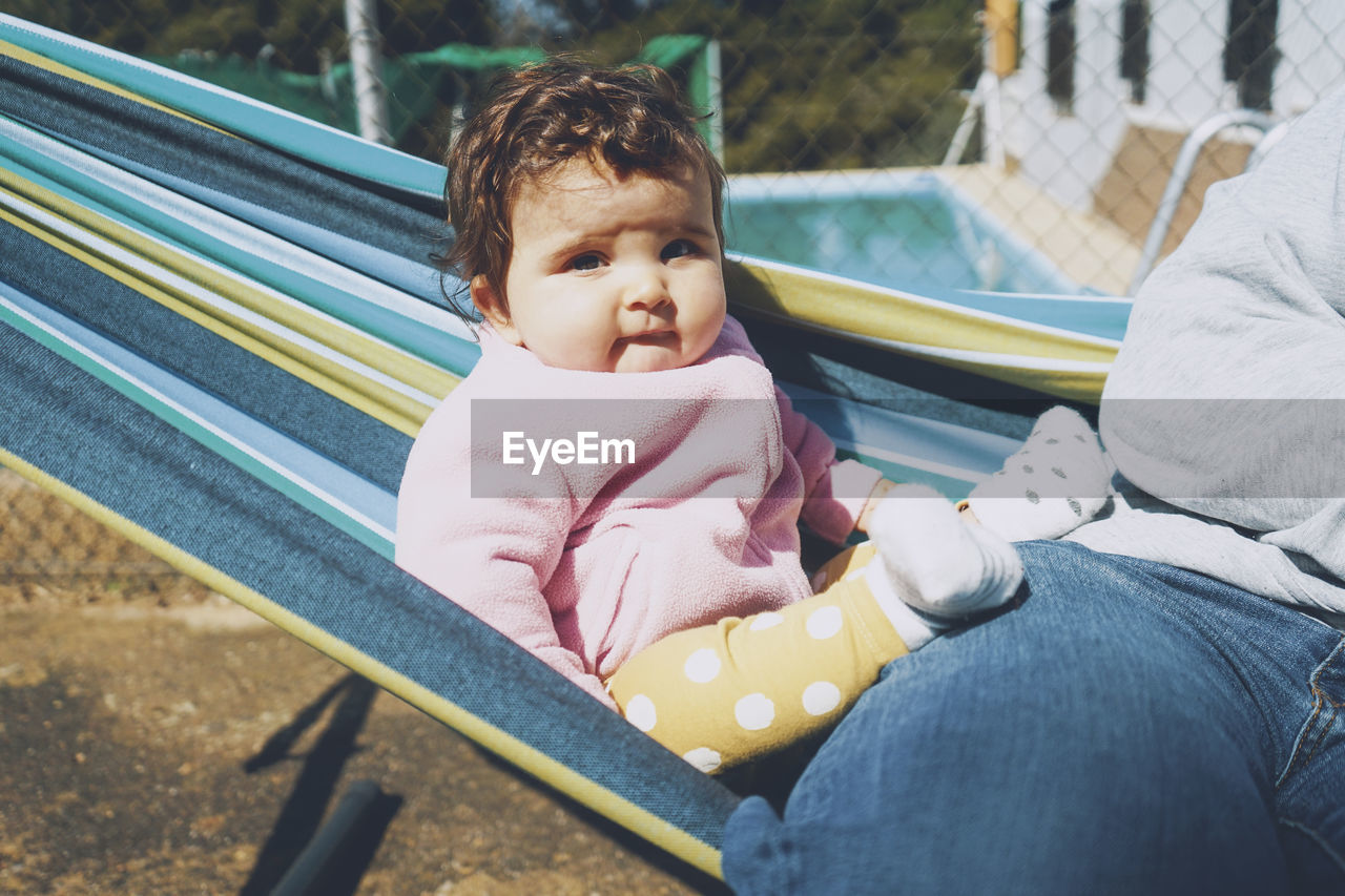 Portrait of mother cute baby with father outdoors