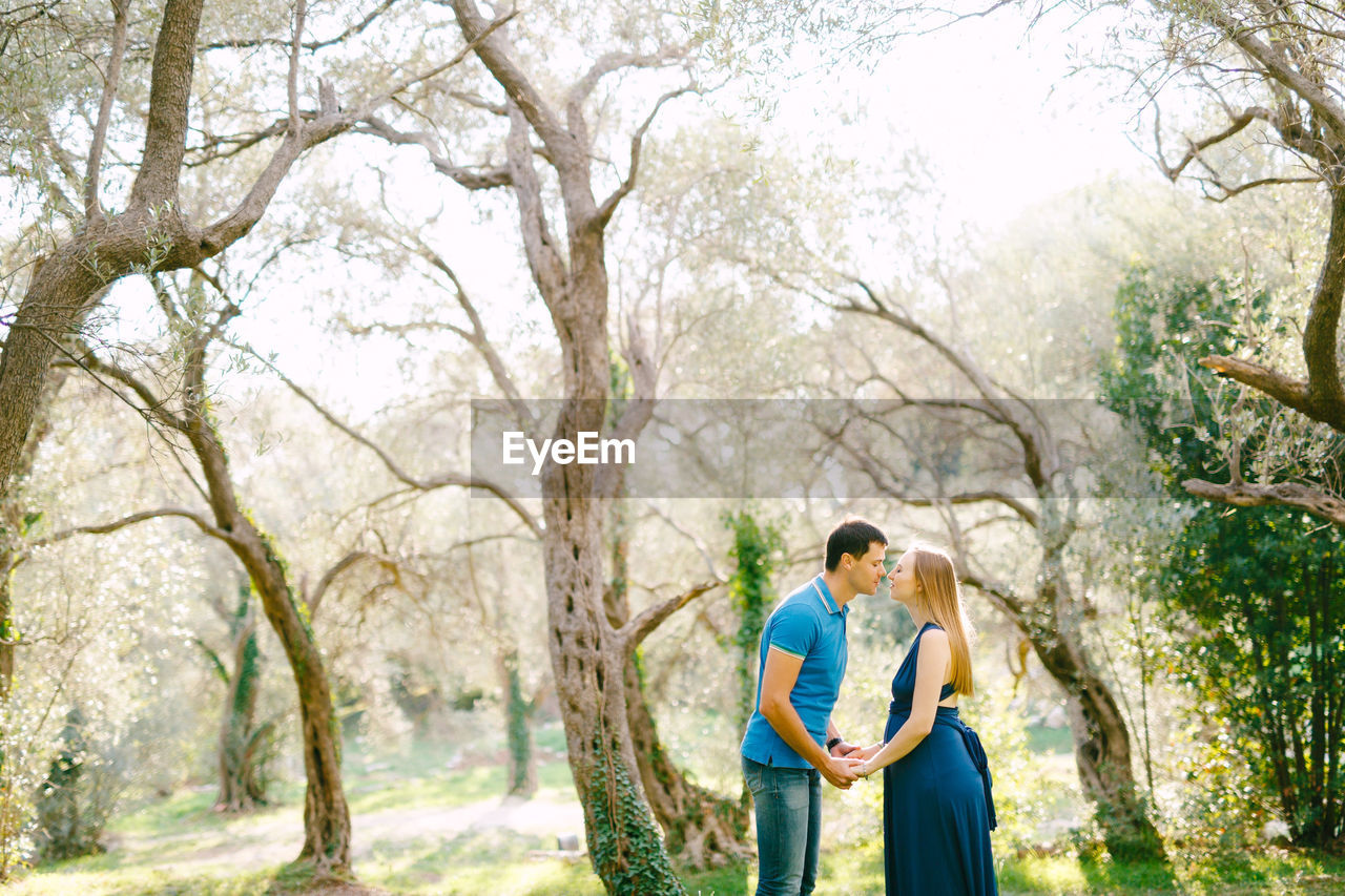 Young couple standing in forest