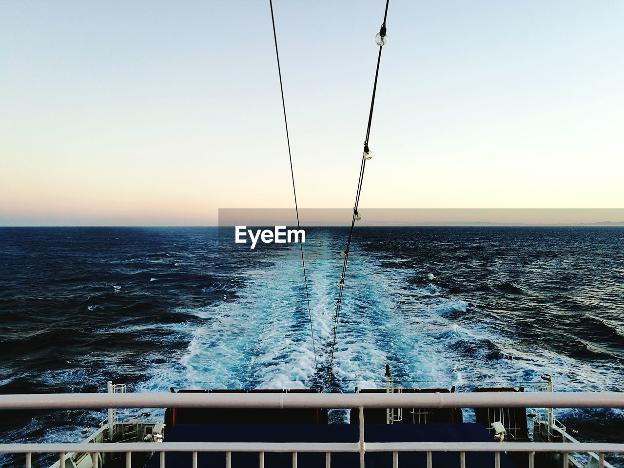 Scenic view of sea against clear sky during sunset