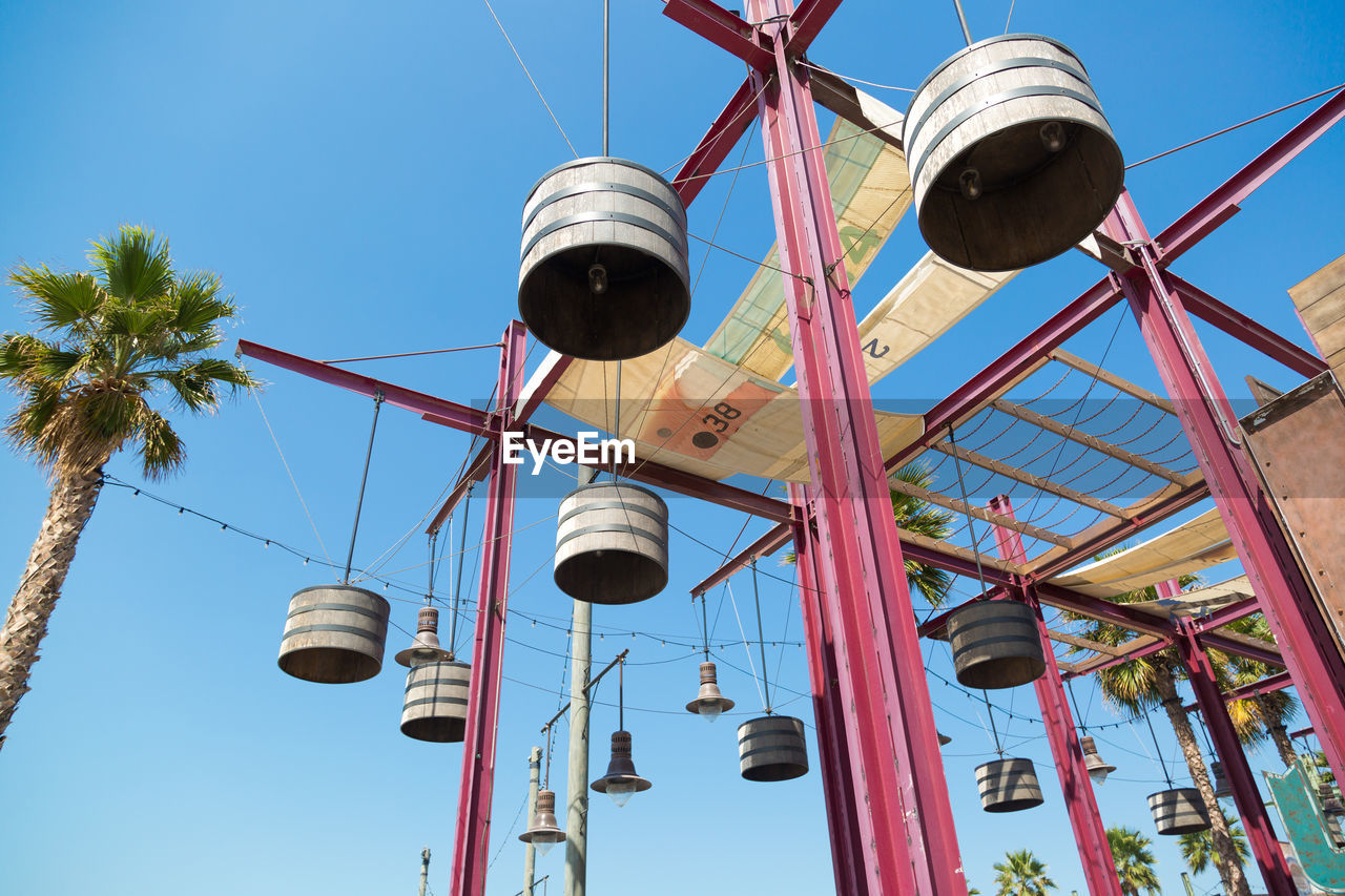 LOW ANGLE VIEW OF CLOCK TOWER AGAINST CLEAR BLUE SKY