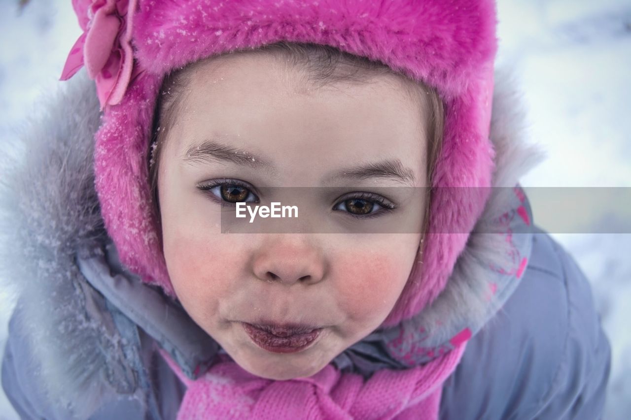 Close-up portrait of girl in warm clothing