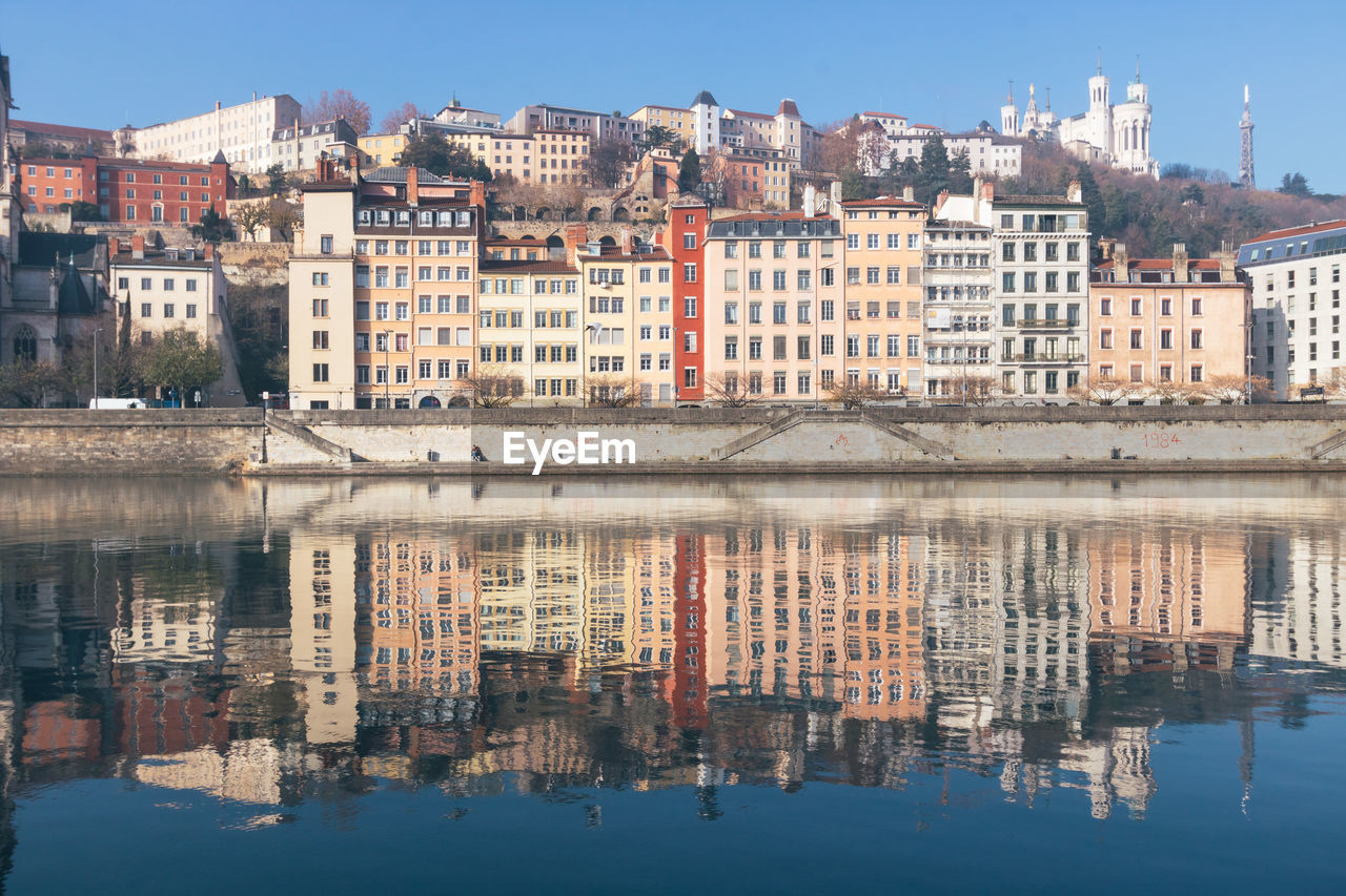 Reflection of old buildings in river