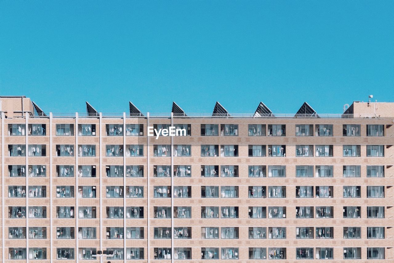 Low angle view of residential building against clear sky