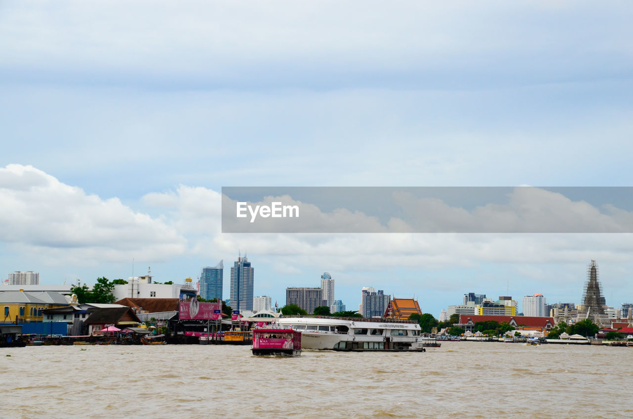 Boats moored on chao phraya river