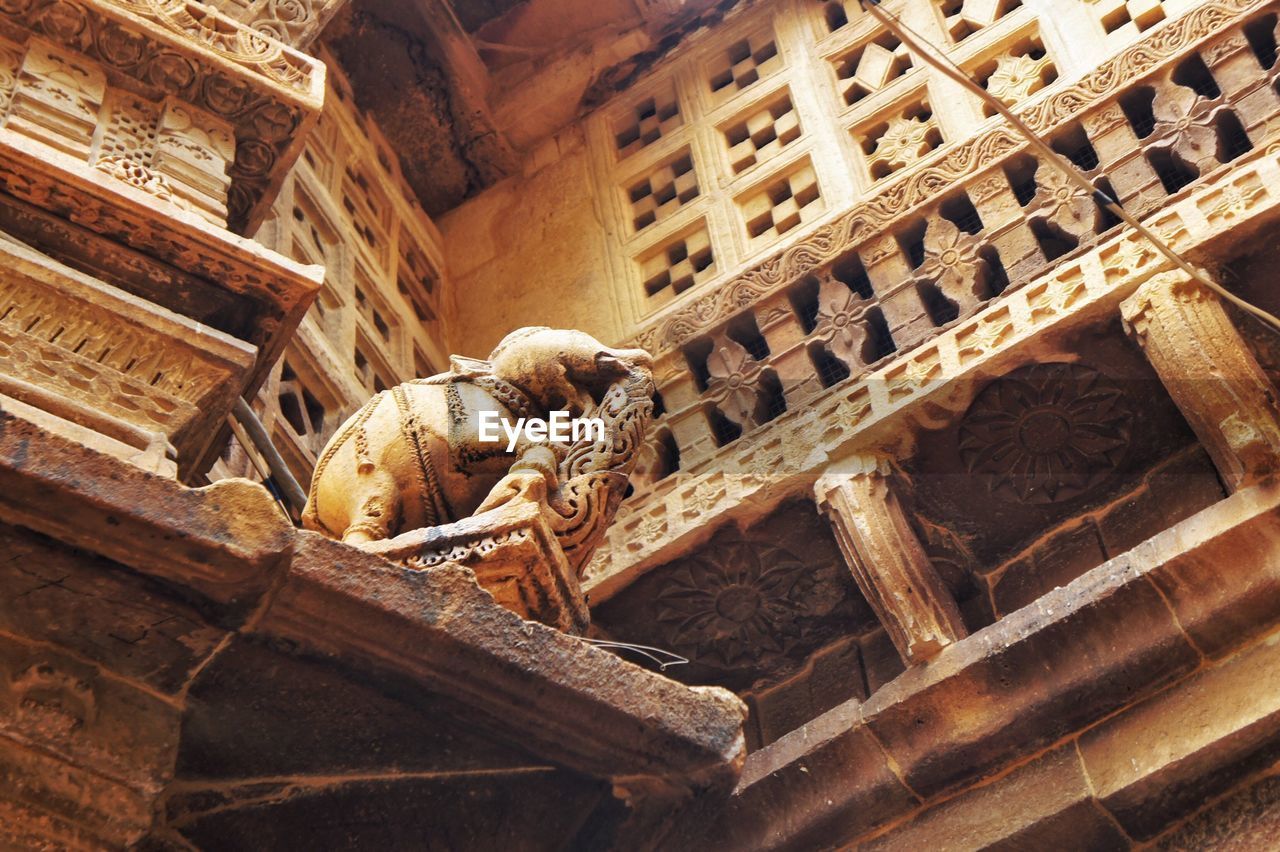 Low angle view of animal sculptures in temple