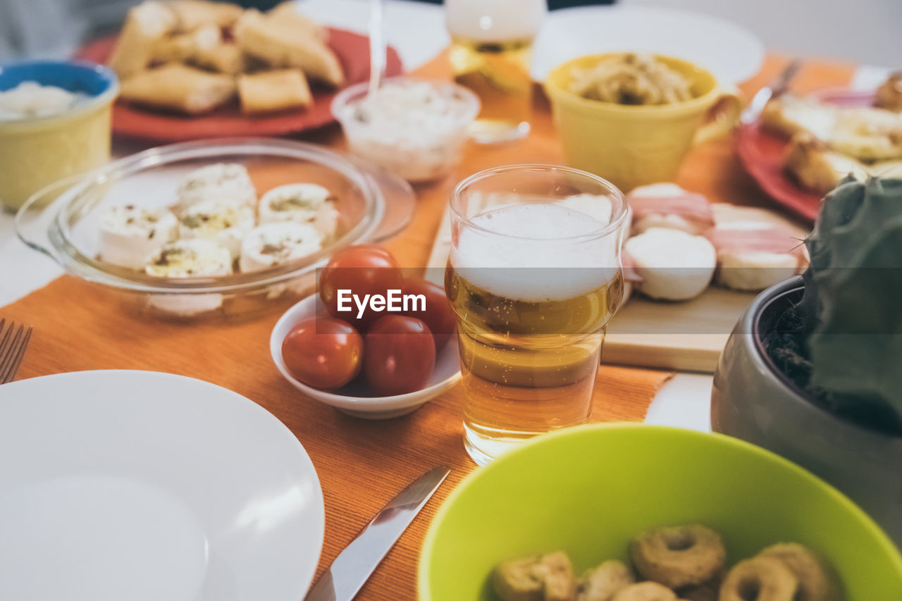 Table with many foods ready for an aperitif with family and friends. dinner at home with finger food