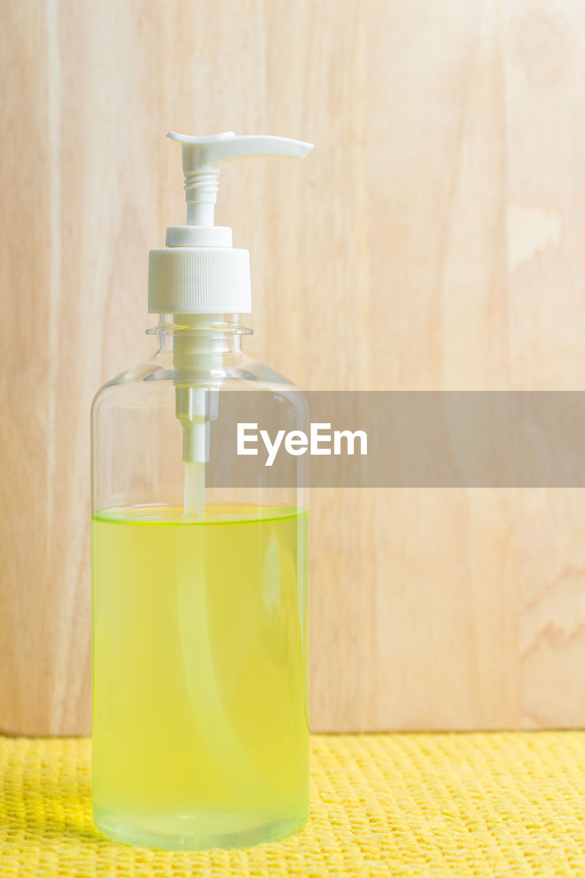 Close-up of hand sanitizer on table