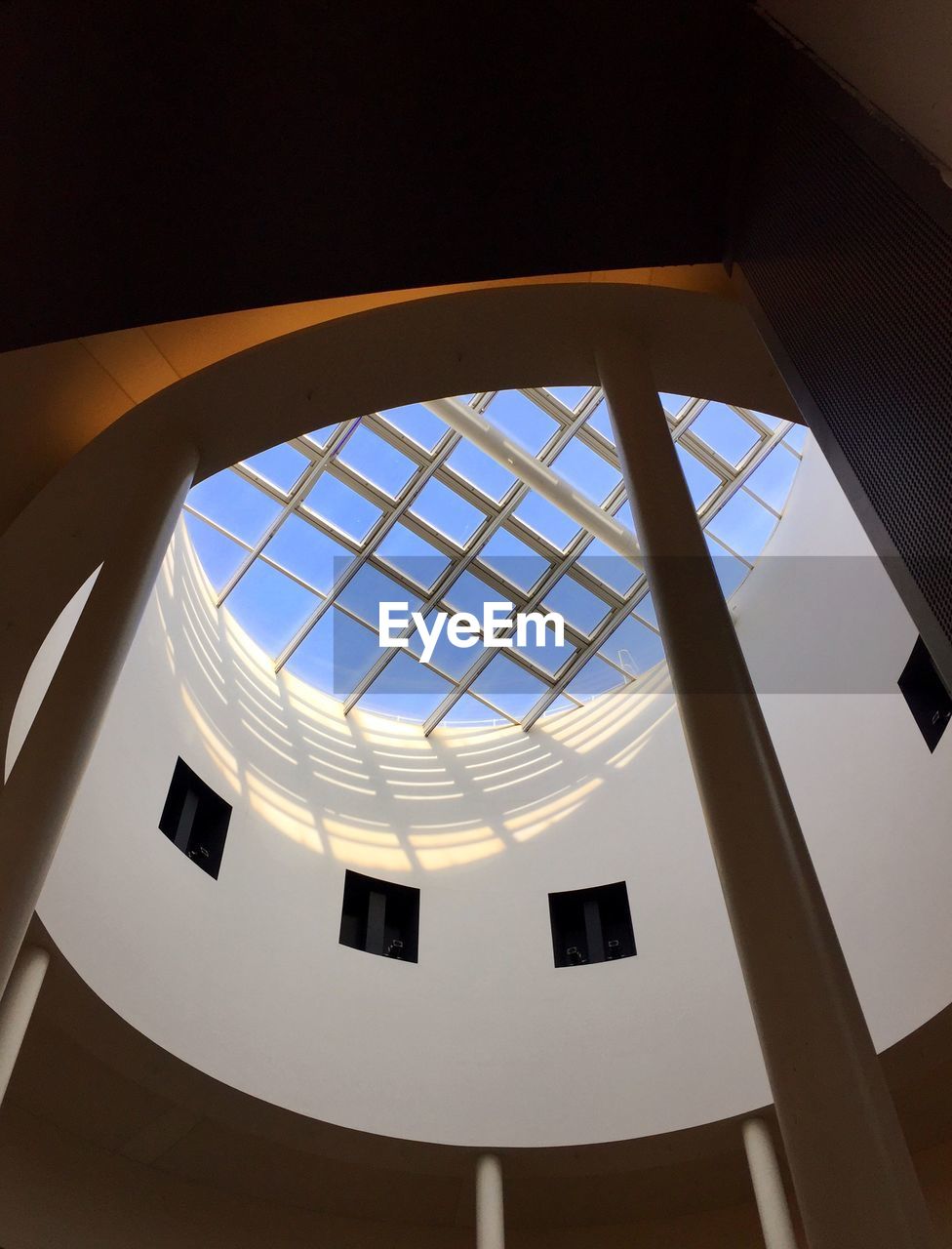 LOW ANGLE VIEW OF SKYLIGHT ON BUILDING