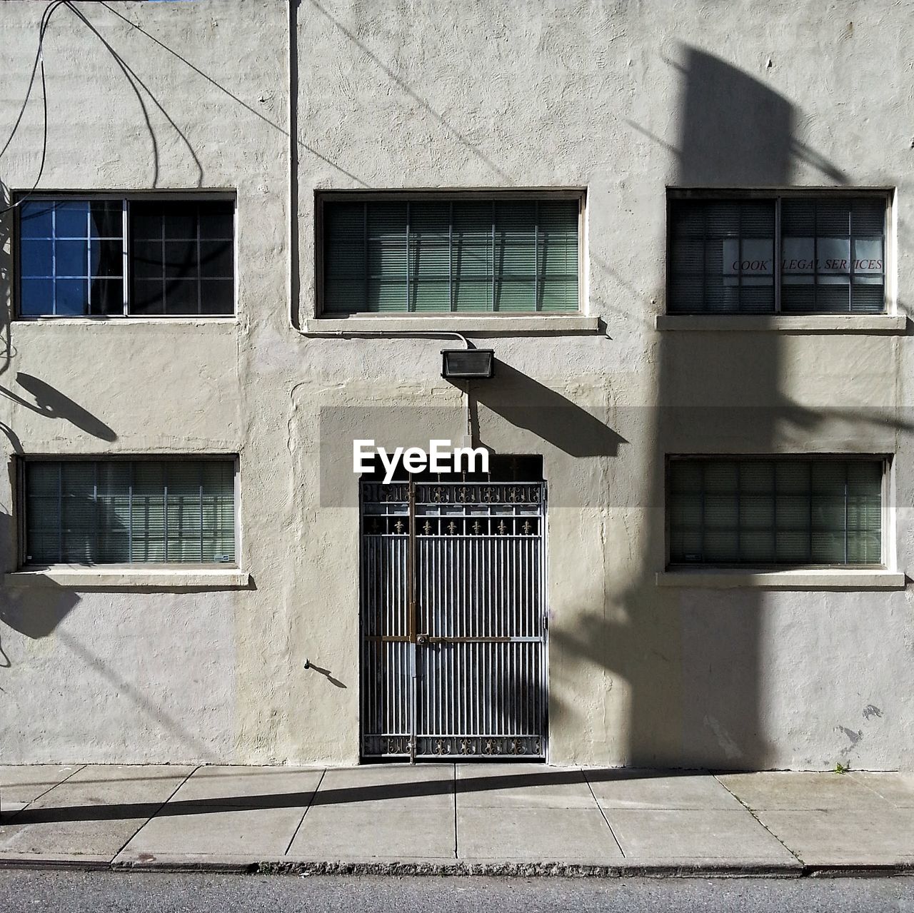 VIEW OF BIRD PERCHING ON BUILDING