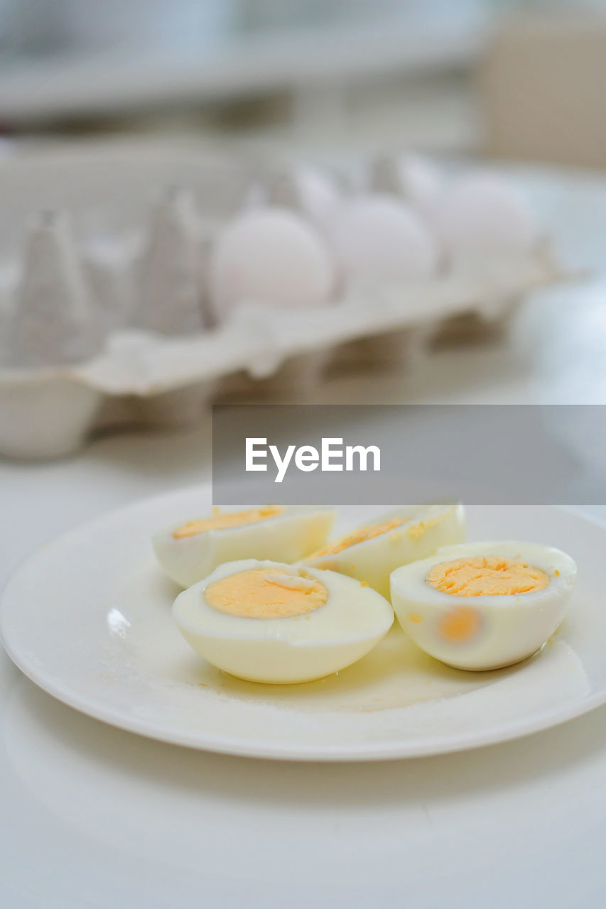 food and drink, egg, food, healthy eating, plate, breakfast, indoors, freshness, wellbeing, no people, egg yolk, close-up, meal, dish, focus on foreground, produce, white, table