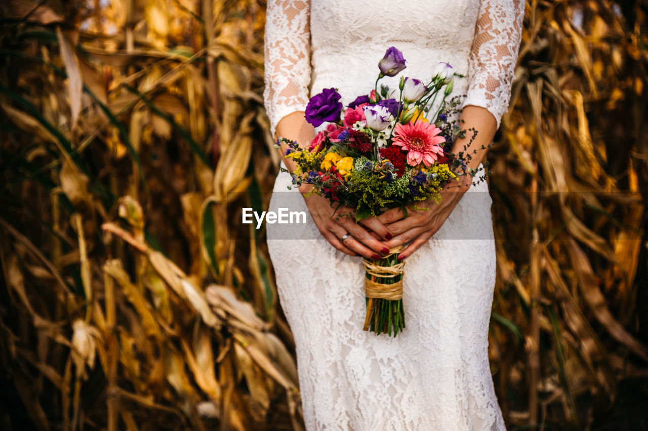 Bride holding flower bouquet