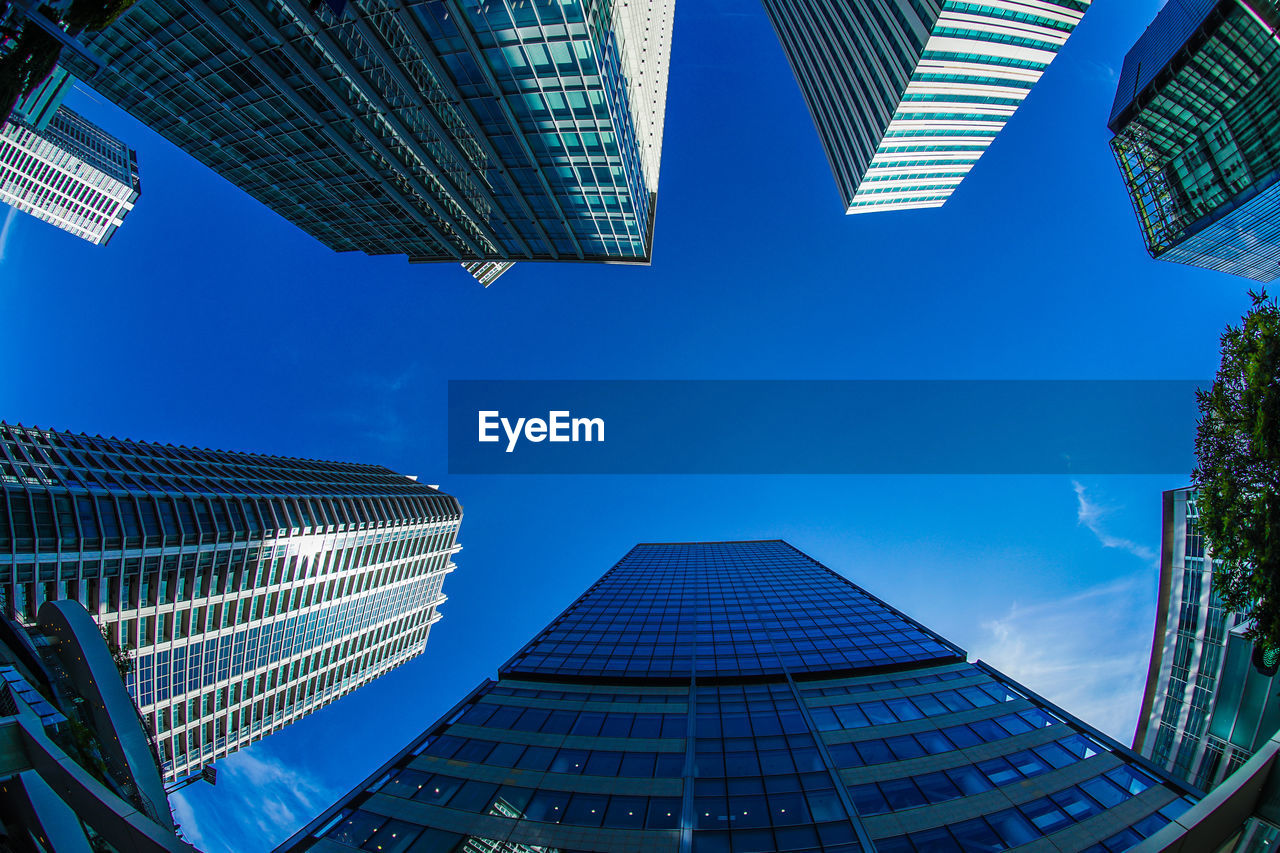 low angle view of skyscrapers against clear sky