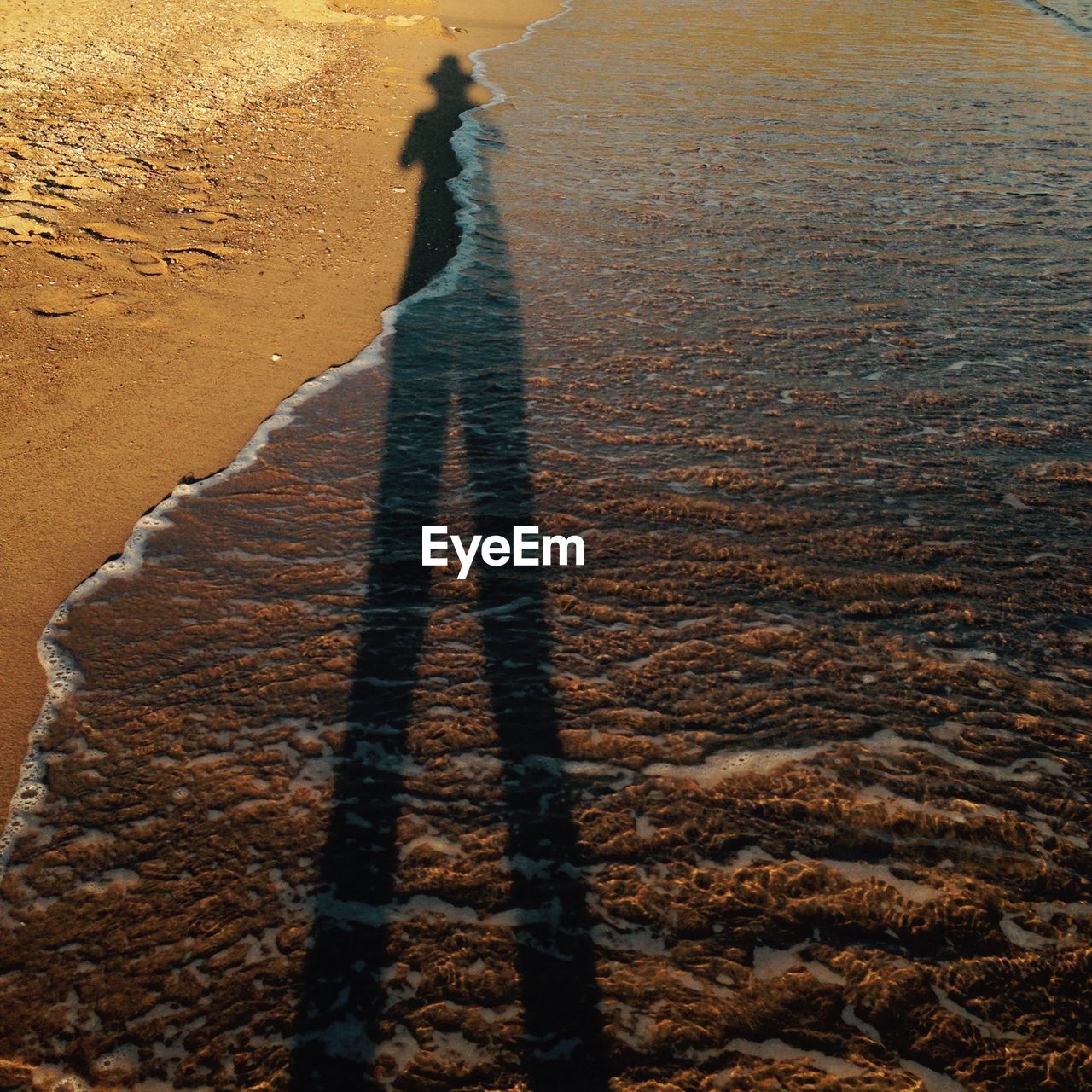 High angle view of shadow on beach