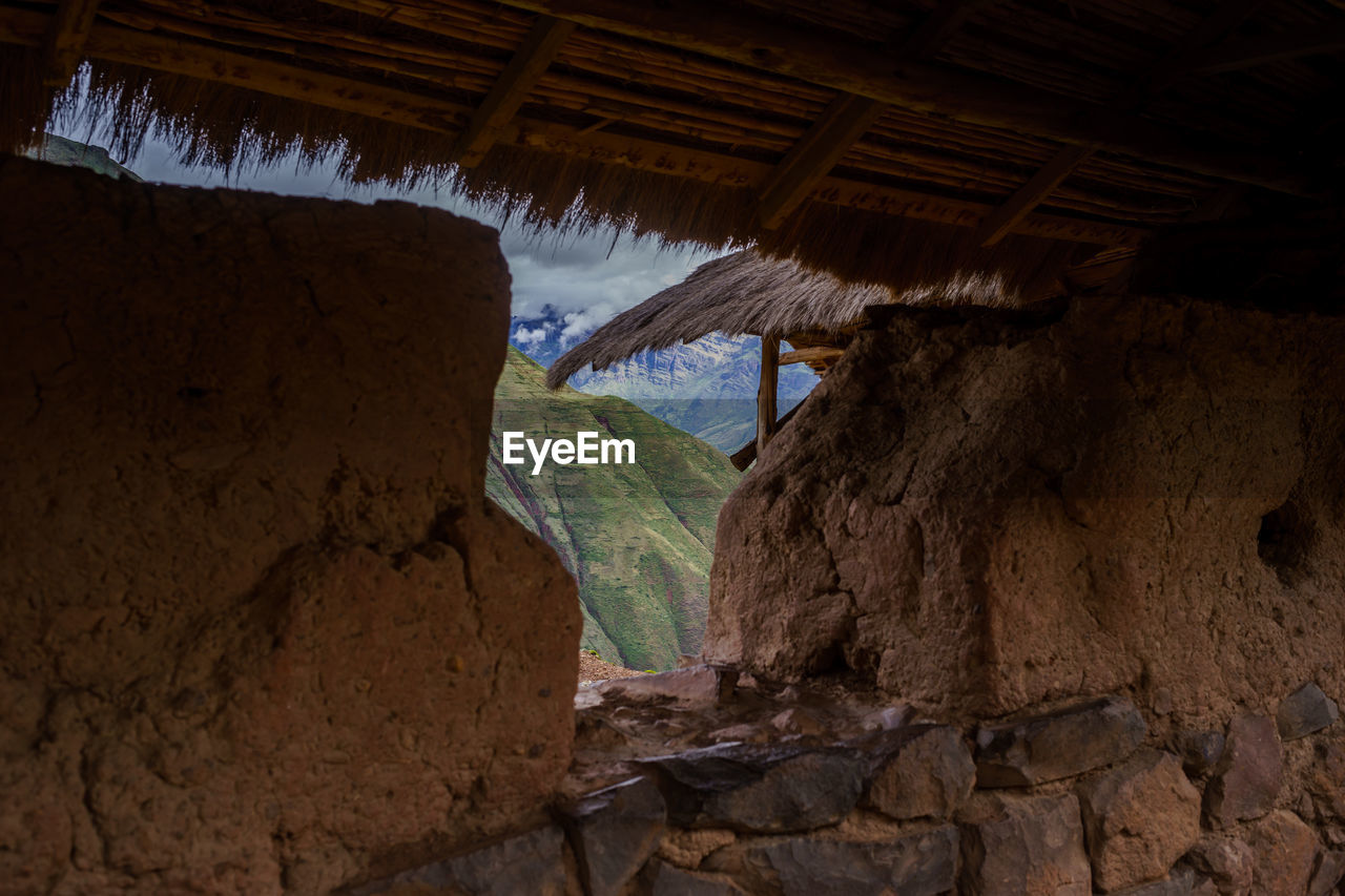 Mountain seen through stone wall