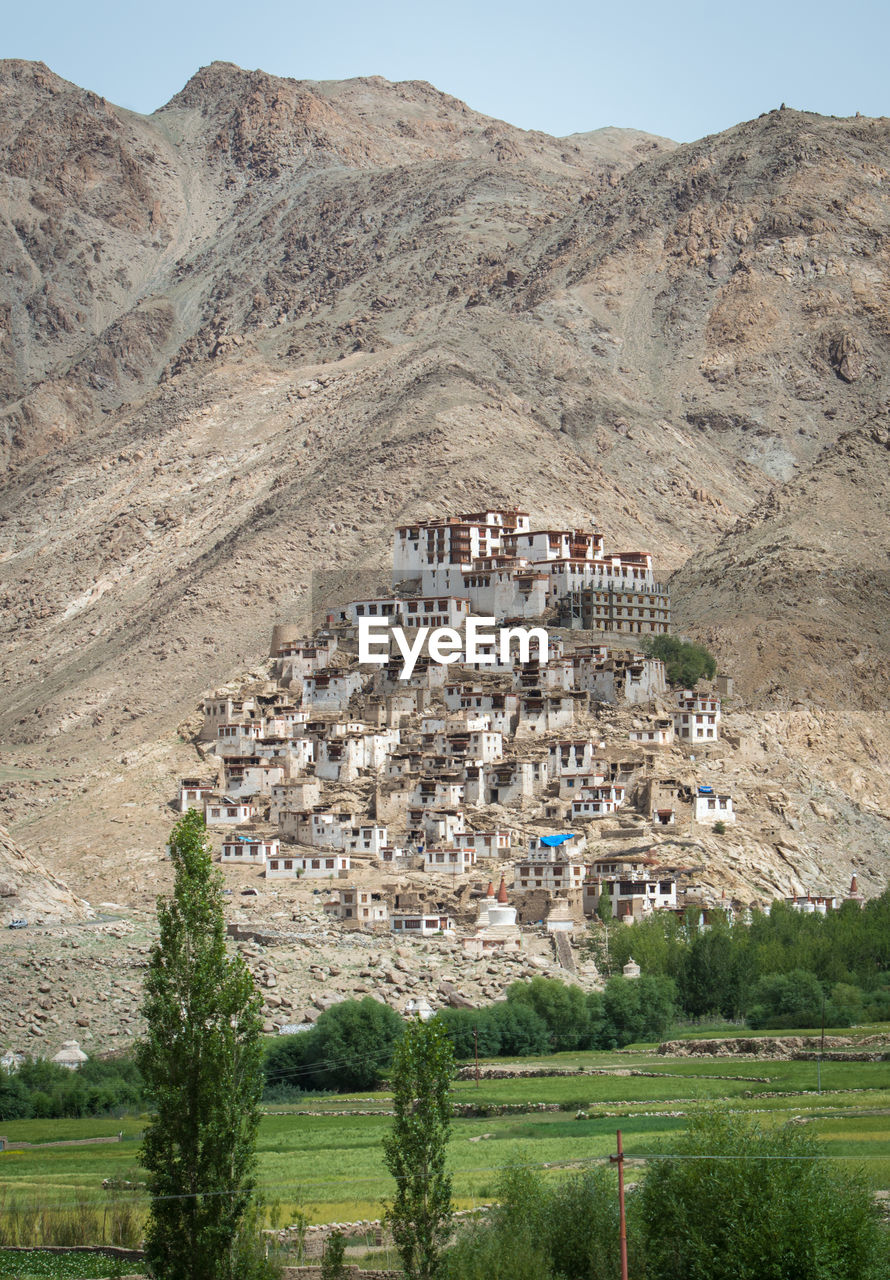 Landscape against town on mountain