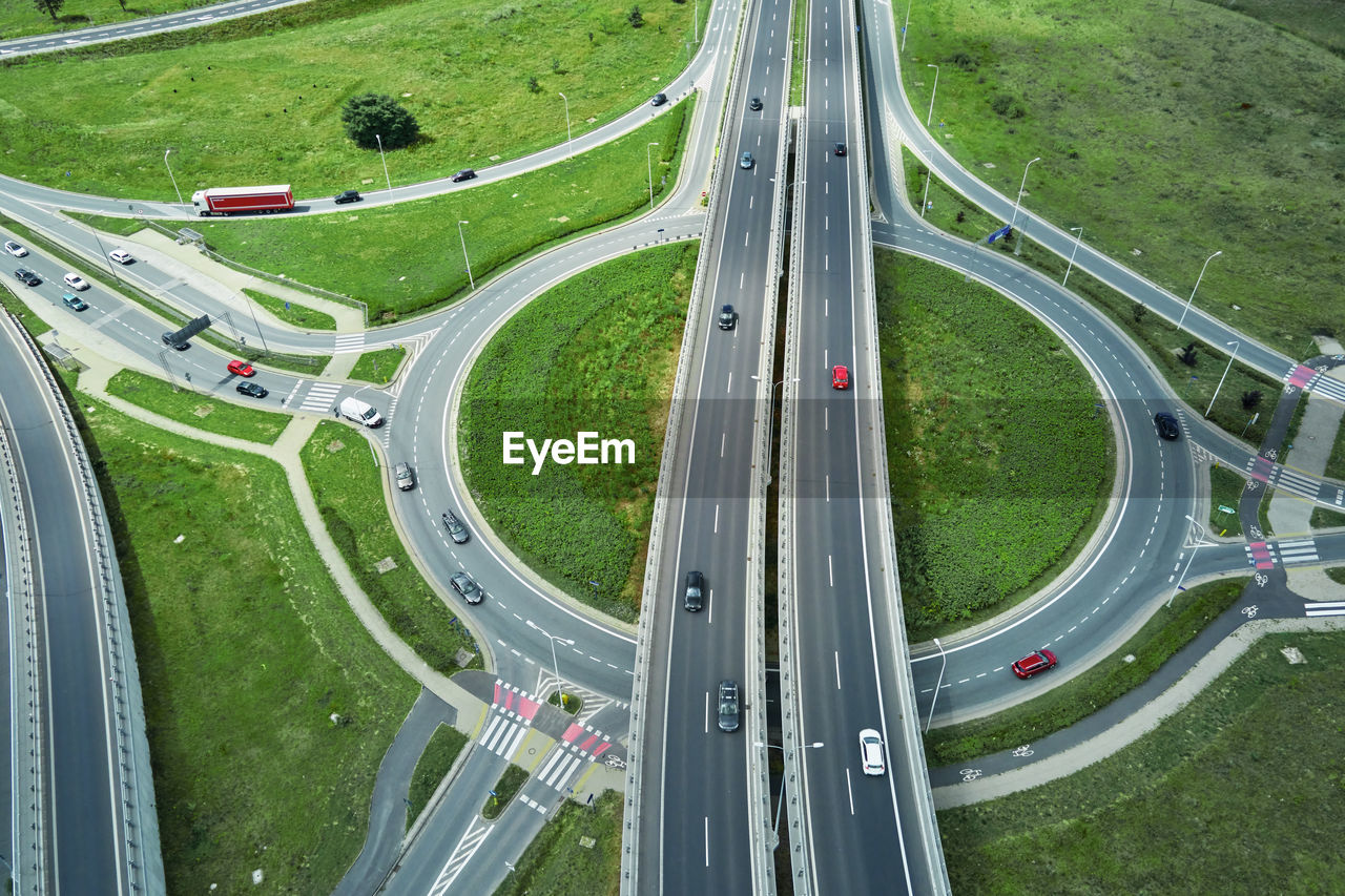 Roundabout intersection with driving cars. car traffic on highway with junction in wroclaw, poland