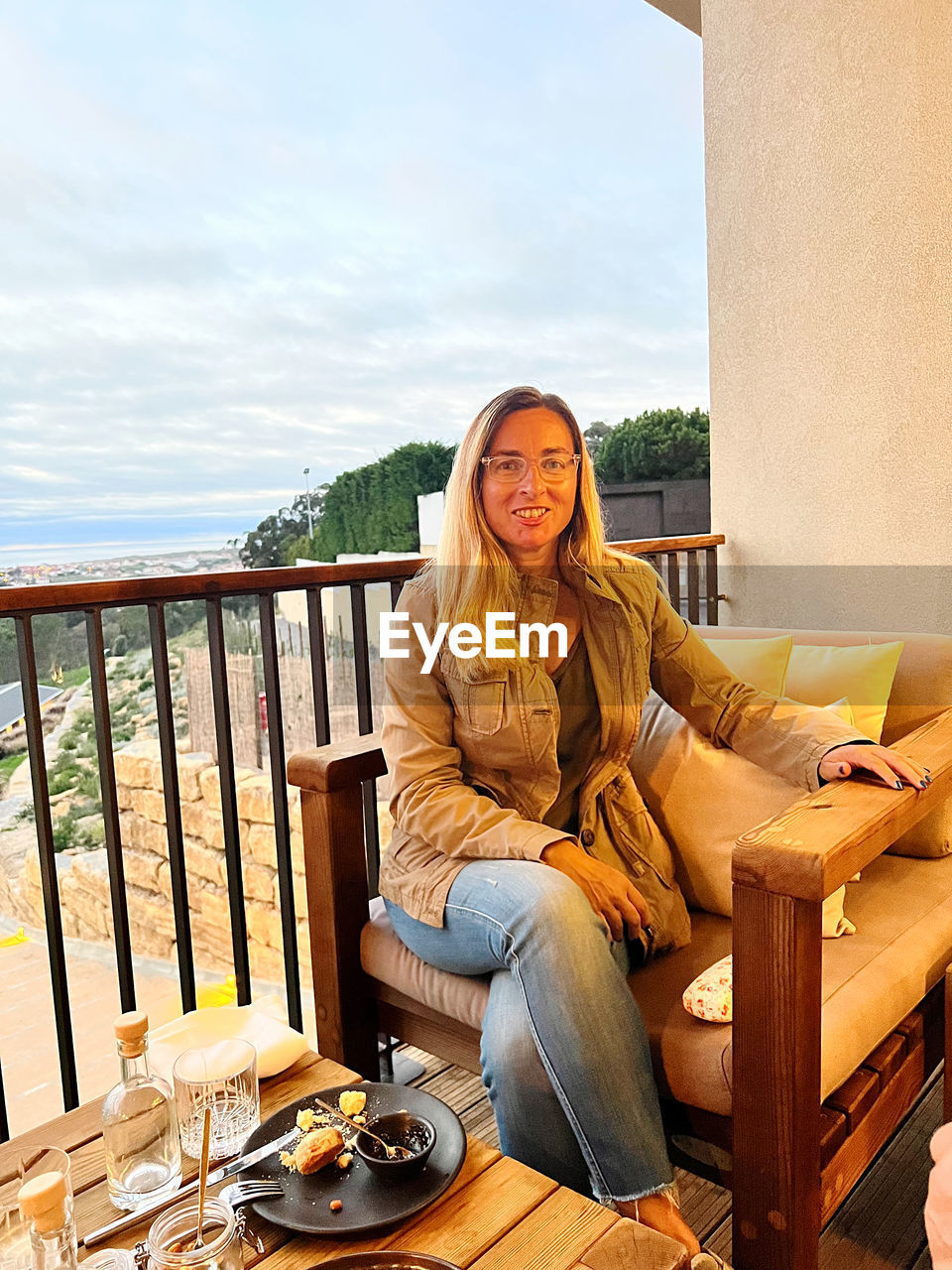 Portrait of young woman sitting on chair