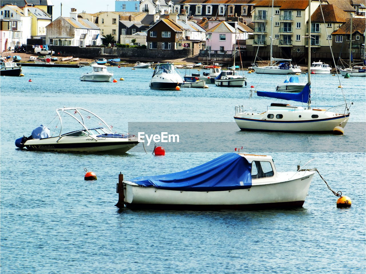 Boats moored at harbor