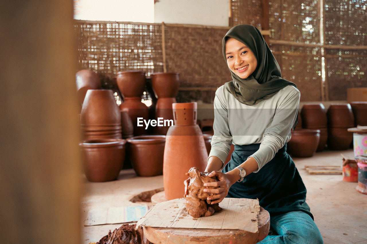 portrait of young woman working on table