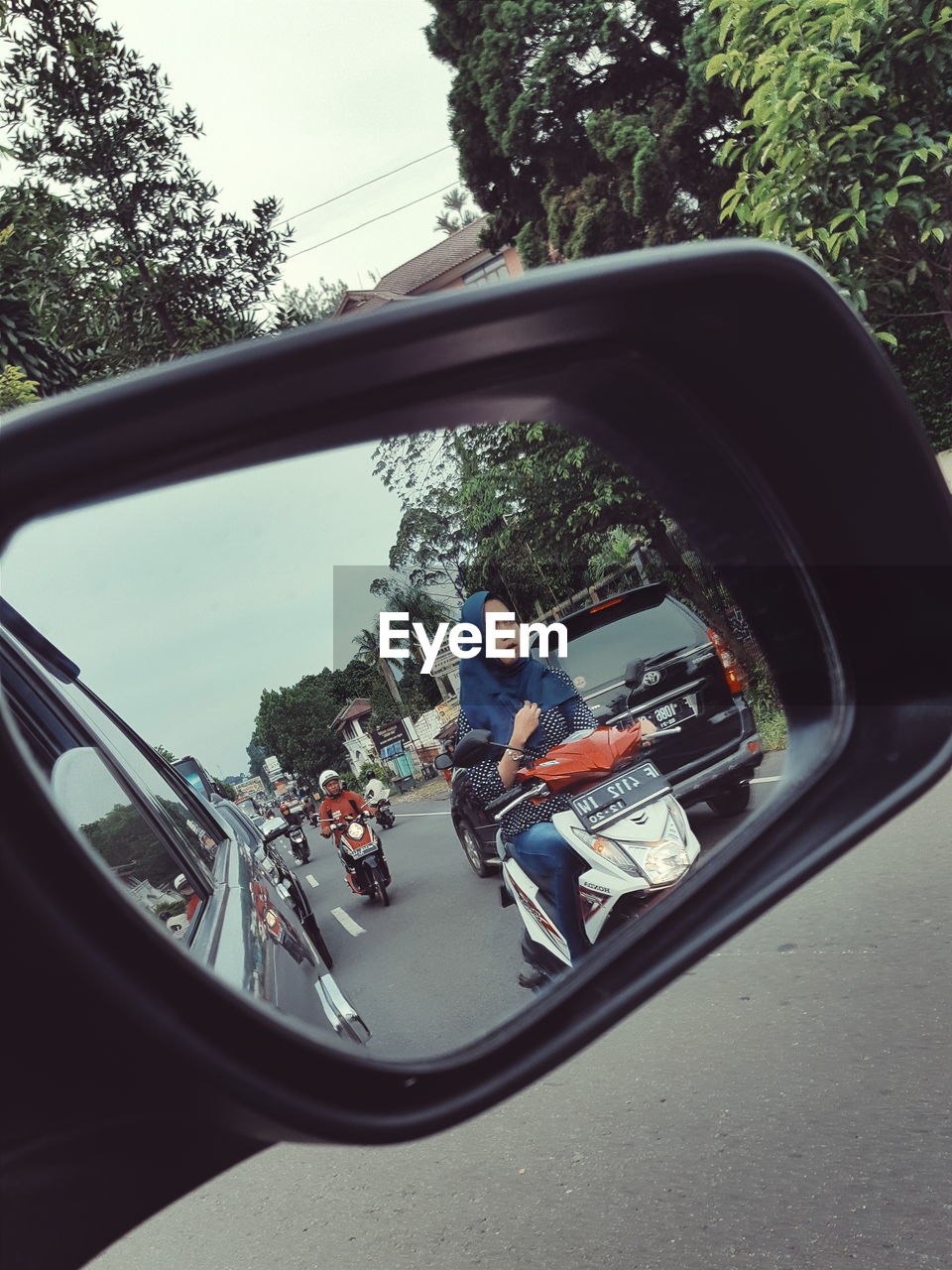 PEOPLE RIDING BICYCLE ON ROAD