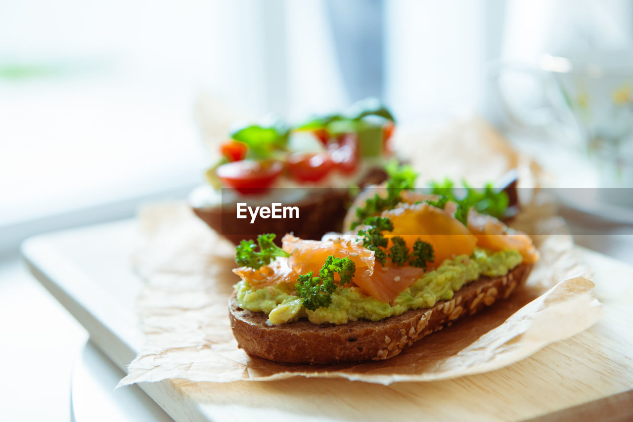 CLOSE-UP OF SANDWICH SERVED ON TABLE