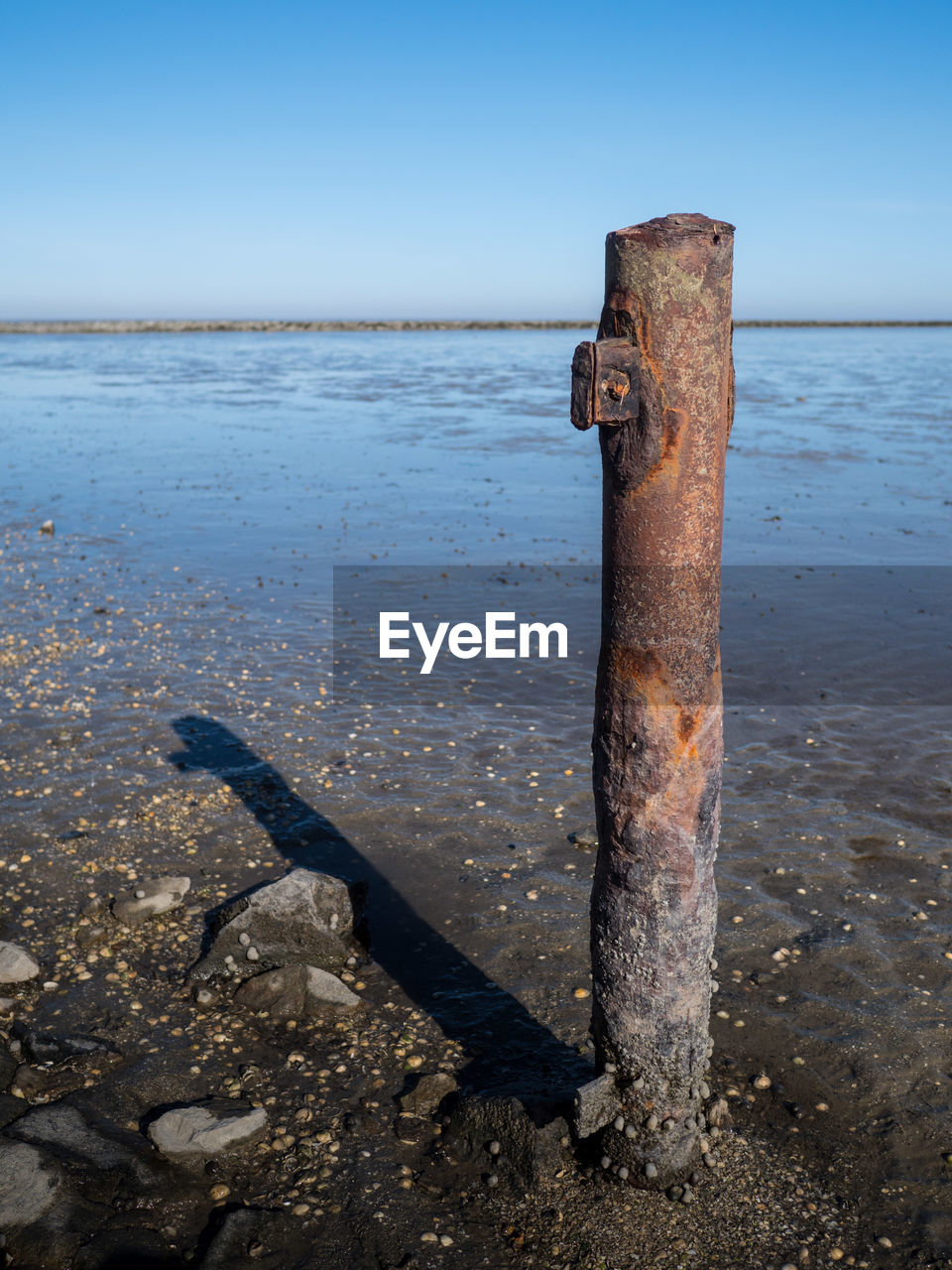 RUSTY METAL ON BEACH