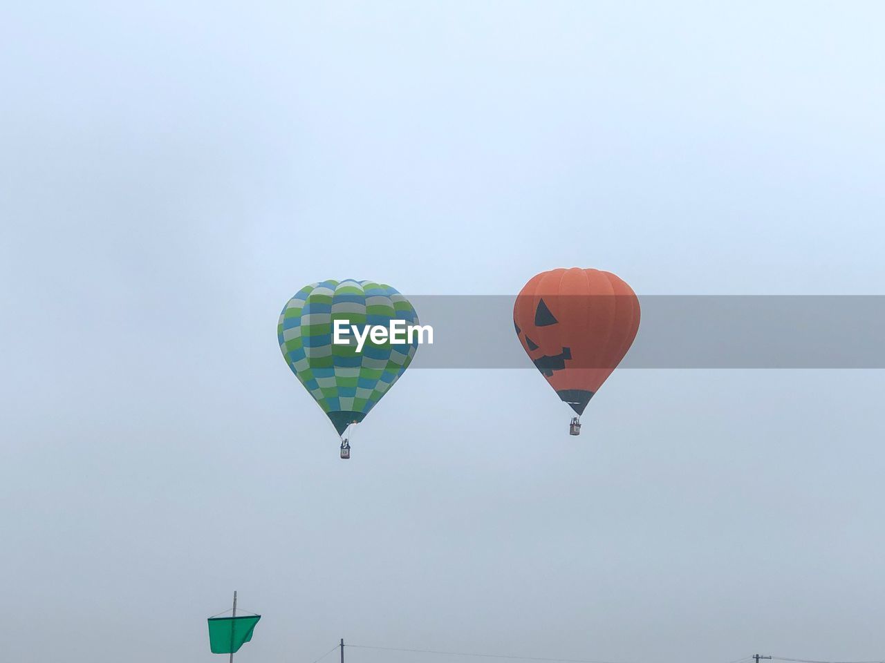 LOW ANGLE VIEW OF HOT AIR BALLOON FLYING IN SKY