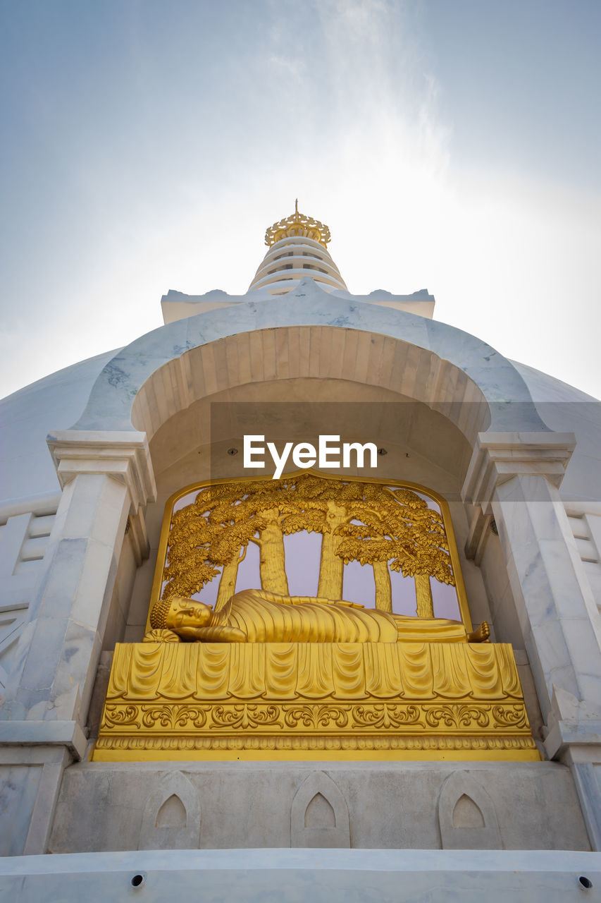 Buddhist stupa isolated with amazing blue sky from unique perspective