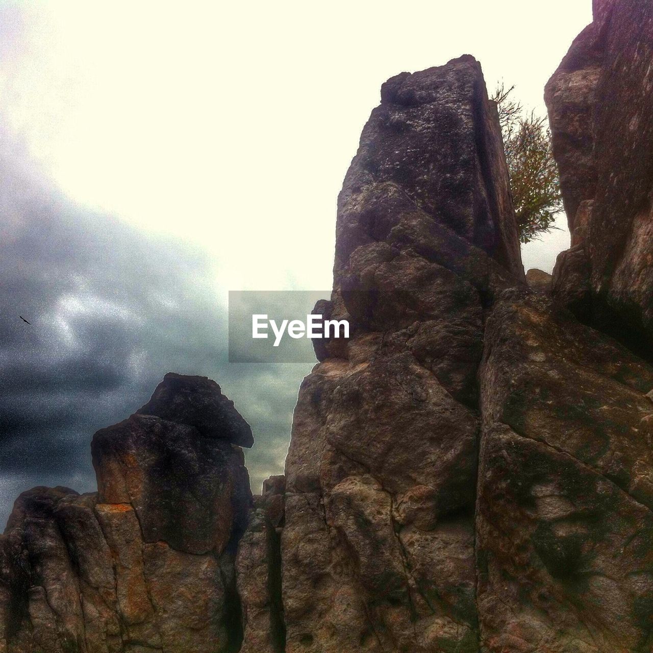 LOW ANGLE VIEW OF ROCKS AGAINST SKY