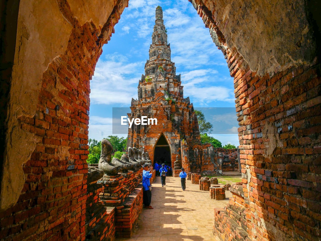 TOURISTS AT OLD TEMPLE BUILDING