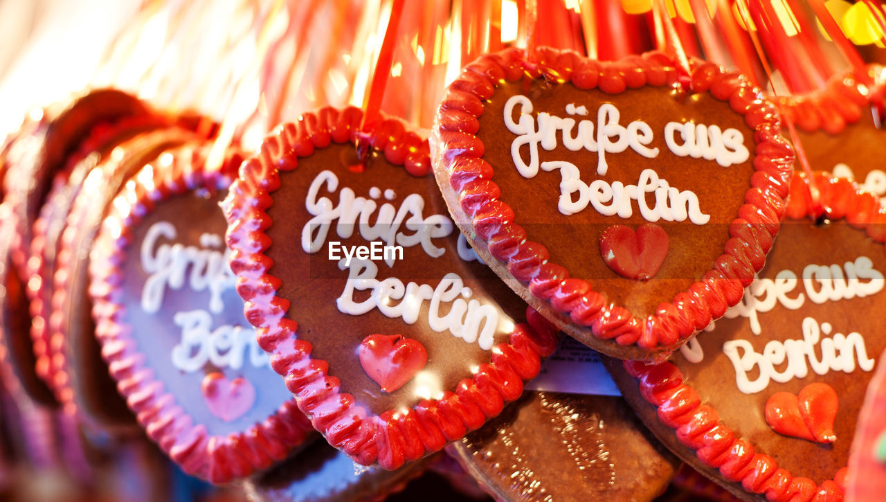 Close-up of heart shape gingerbreads with text for sale at market