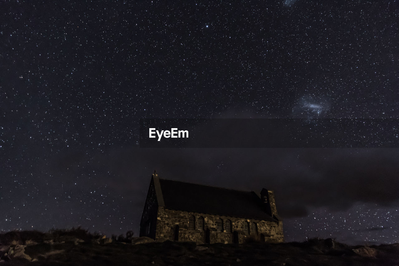 BUILT STRUCTURE AGAINST STAR FIELD AT NIGHT