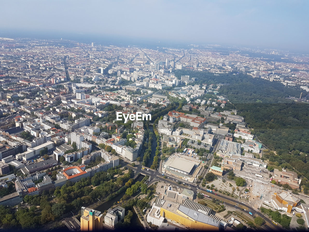 HIGH ANGLE VIEW OF ILLUMINATED CITY BUILDINGS