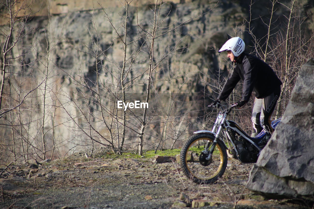 WOMAN CYCLING ON BICYCLE