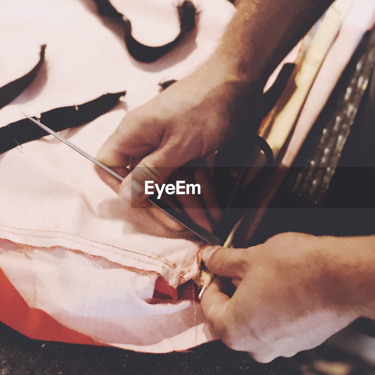 CLOSE-UP OF MAN WORKING IN WORKSHOP