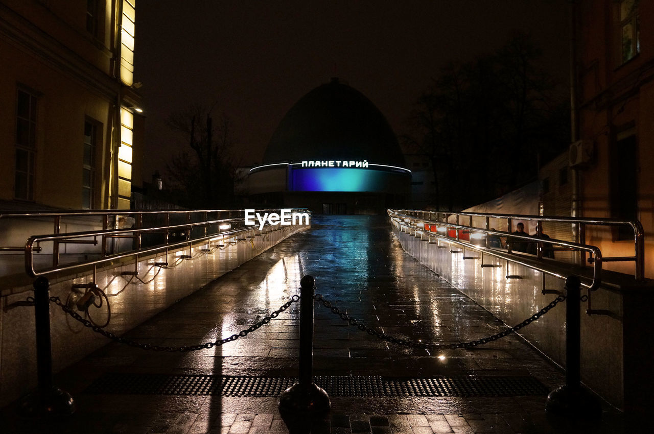 VIEW OF ILLUMINATED BRIDGE AT NIGHT