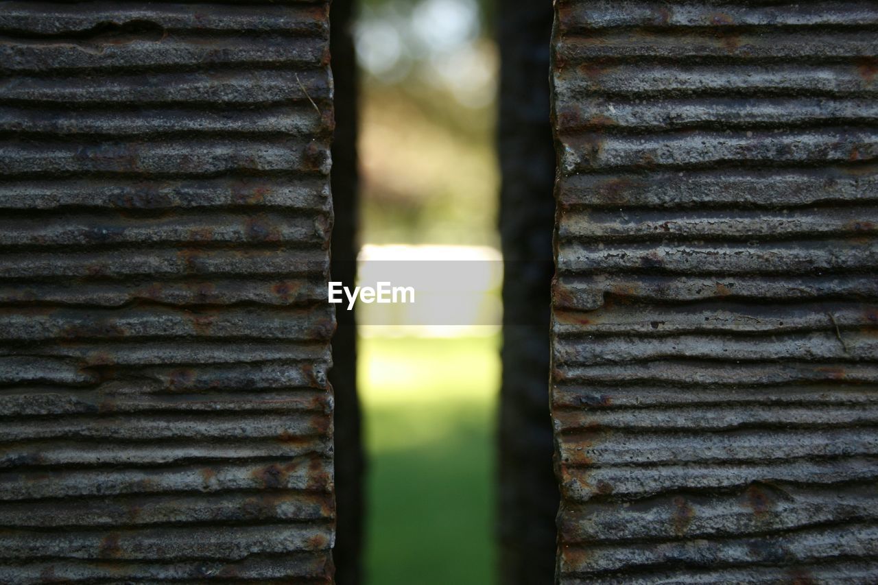 CLOSE-UP OF RUSTY METAL IN CONTAINER