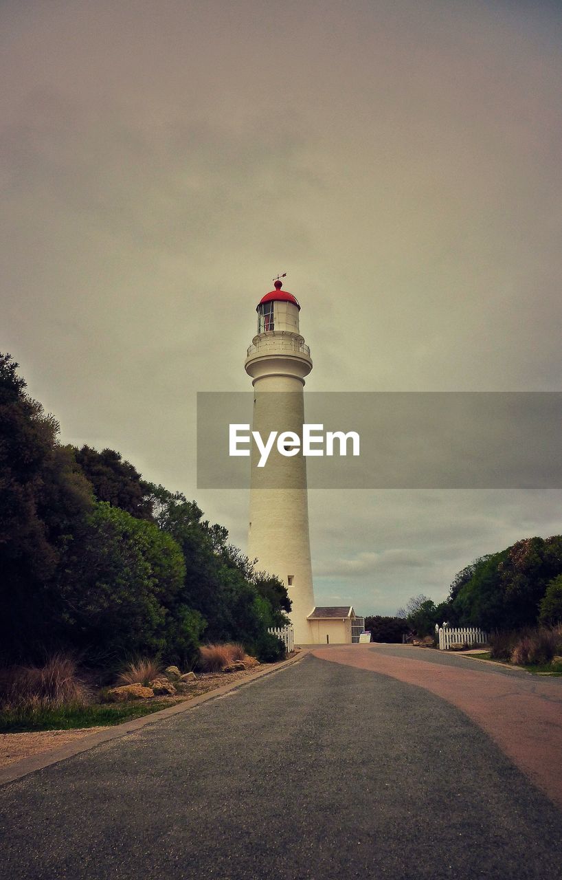 View of lighthouse against cloudy sky