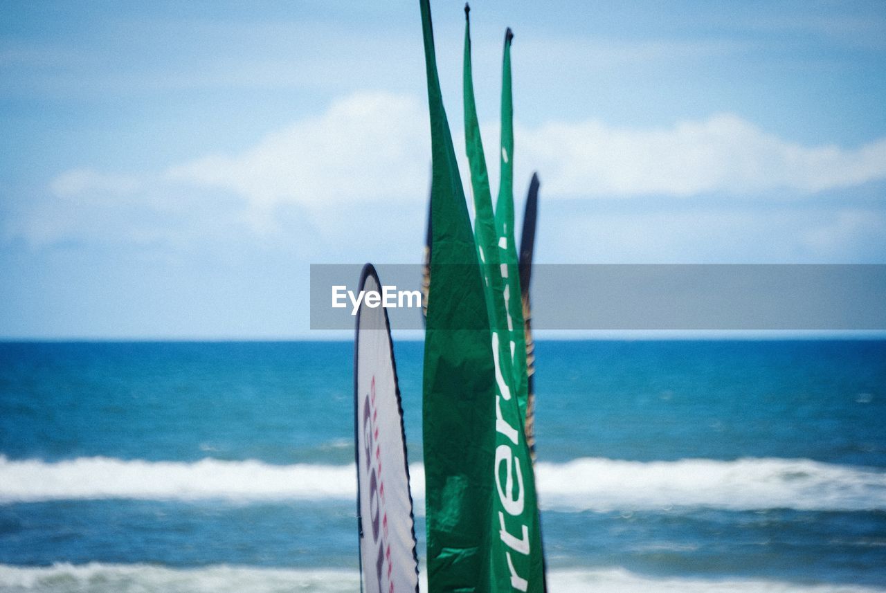 Flags against sea